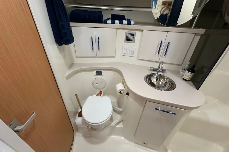 Slide: The Image of Storage area in a 1996 Mainship 40 Sedan Bridge with tools and equipment. - 30