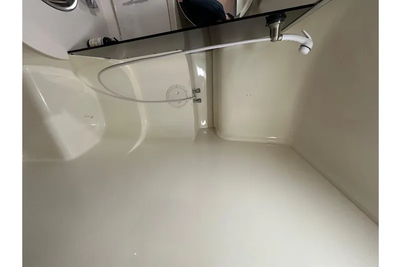 Slide: The Image of Bathroom interior of 1996 Mainship 40 Sedan Bridge with sink and mirror. - 33