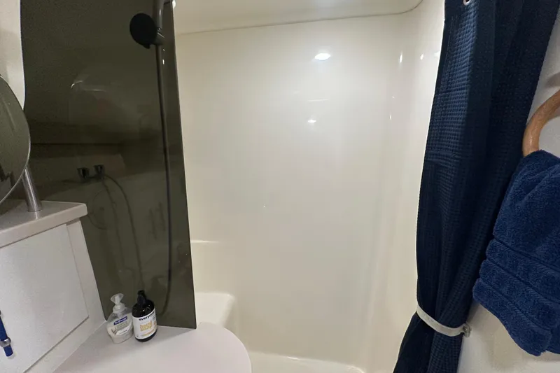 Slide: The Image of 1996 Mainship 40 Sedan Bridge interior with sleek, modern sink and faucet design. - 34