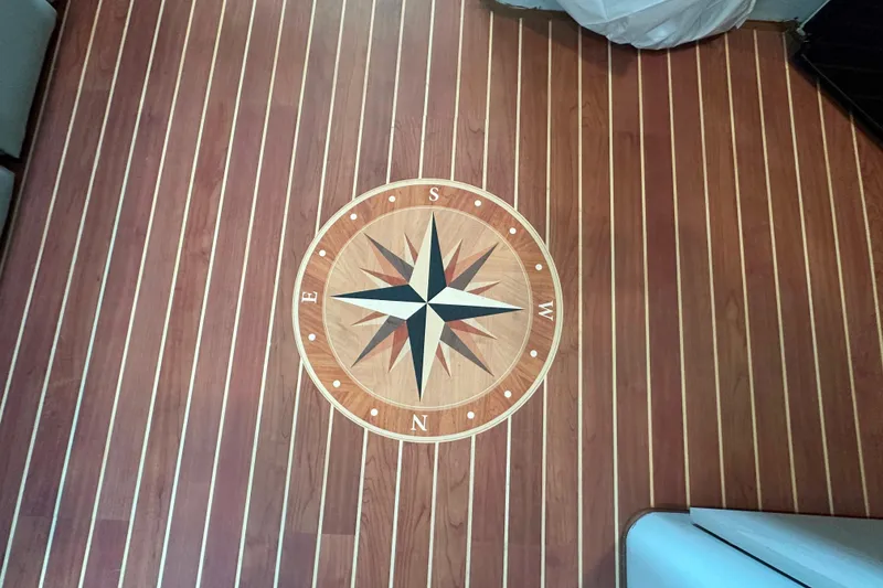 Slide: The Image of 1996 Mainship 40 Sedan Bridge bathroom with sink, toilet, and storage cabinets. - 36