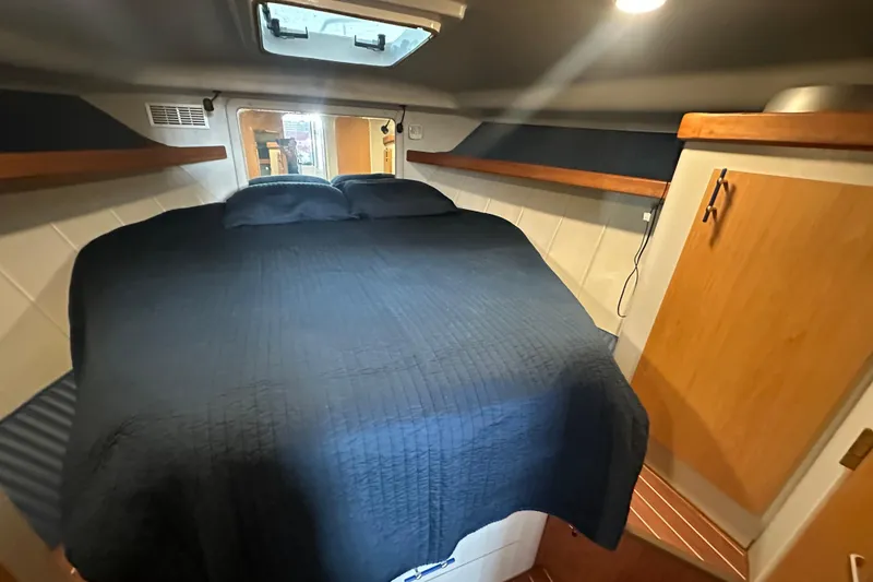 Slide: The Image of Teak floor with compass rose design on 1996 Mainship 40 Sedan Bridge. - 37