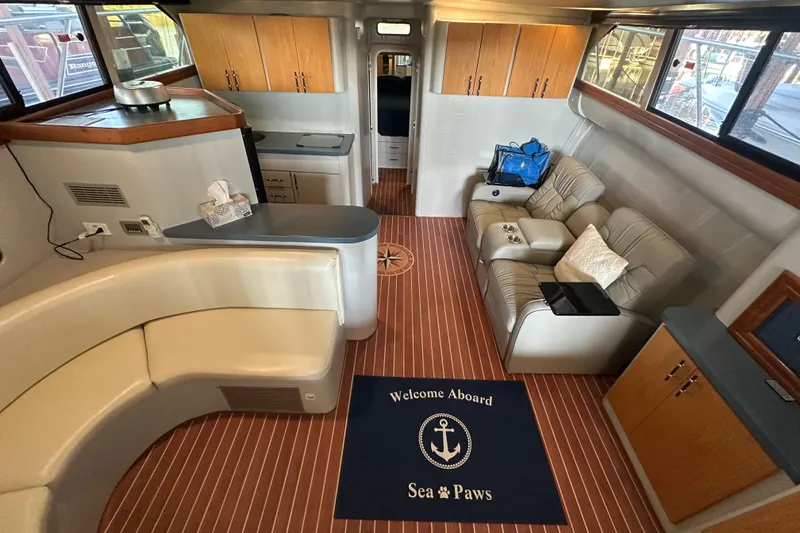 Slide: The Image of Interior of 1996 Mainship 40 Sedan Bridge with cozy seating and nautical decor. - 44