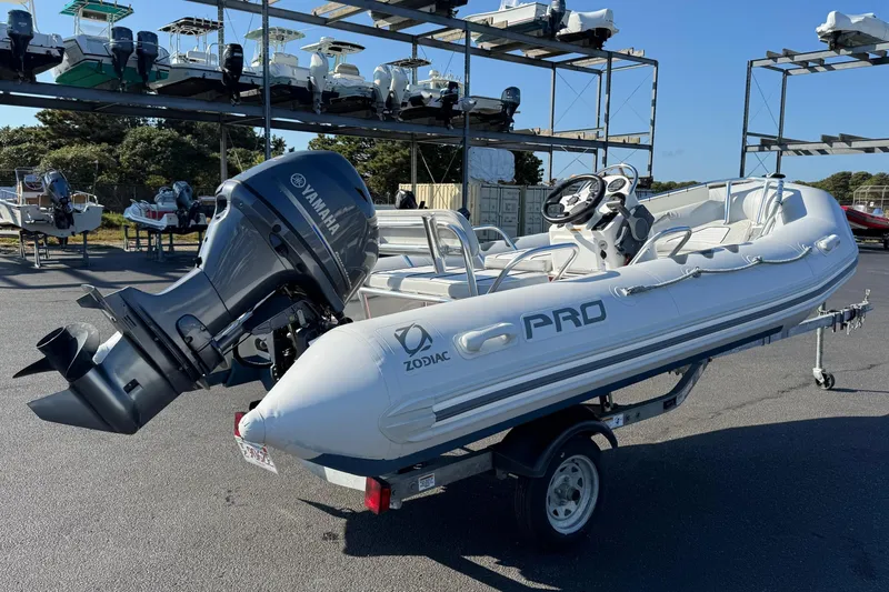 Slide: The Image of 2013 Zodiac 500 Bayrunner boat with Yamaha engine on trailer in marina. - 4