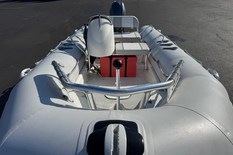 Slide: The Image of 2013 Zodiac 500 Bayrunner inflatable boat with steering console and seating, viewed from the bow. - 5