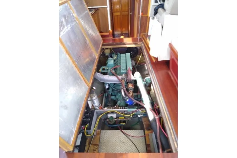 Slide: The Image of Engine compartment of a 1979 Mainship 34 Custom Sedan boat, showcasing detailed machinery. - 27