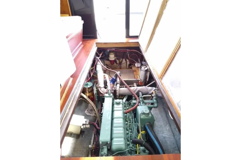Slide: The Image of Engine room of 1979 Mainship 34 Custom Sedan with visible components and wiring. - 28