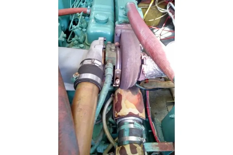Slide: The Image of Engine components of a 1979 Mainship 34 Custom Sedan boat. - 32