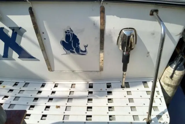 Slide: The Image of 1979 Mainship 34 Custom Sedan boat deck with nautical design and chrome details. - 4