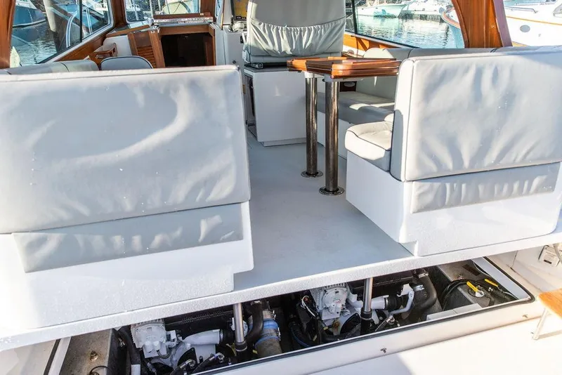 Slide: The Image of Interior of 2012 Hunt Yachts Harrier 36 Express with seating and table. - 24