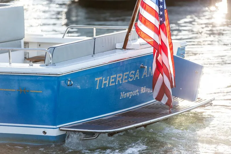 Slide: The Image of 2012 Hunt Yachts Harrier 36 Express with American flag, docked in Newport, RI. - 5