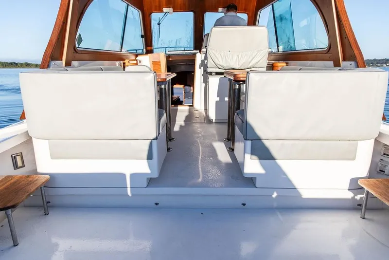 Slide: The Image of Interior view of 2012 Hunt Yachts Harrier 36 Express, featuring seating and helm. - 9