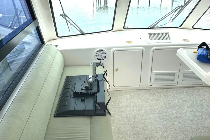 Slide: The Image of Interior of 1999 Riviera Convertible SF boat with seating and mounted equipment. - 14