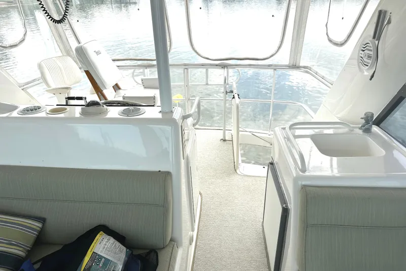 Slide: The Image of Interior of 1999 Riviera Convertible SF yacht with seating and sink area. - 17