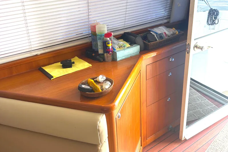 Slide: The Image of Interior of 1999 Riviera Convertible SF with wooden cabinetry and various items on the counter. - 26