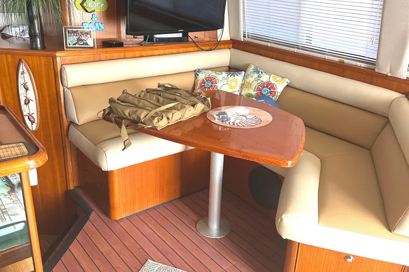 Slide: The Image of Cozy interior of 1999 Riviera Convertible SF with dining area and decorative pillows. - 28