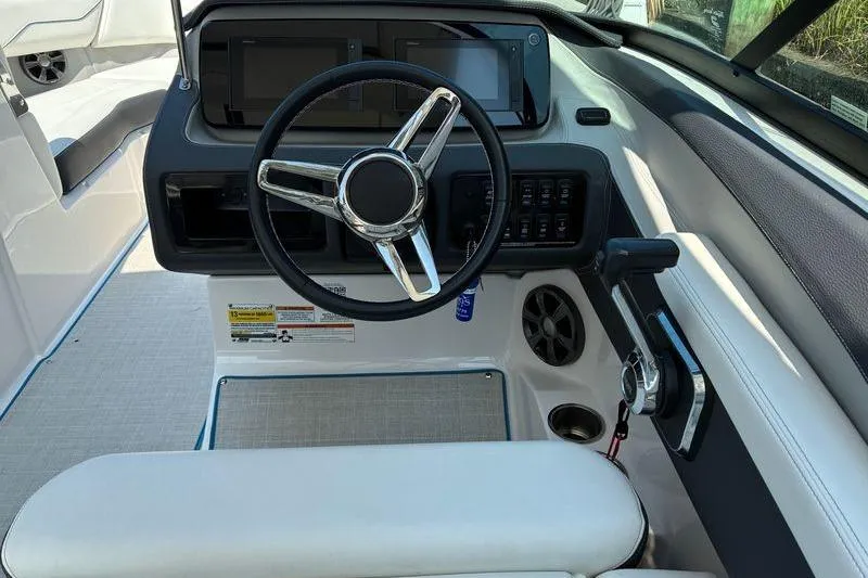Slide: The Image of 2020 Regal LS4 boat cockpit with modern steering wheel and control panel. - 12