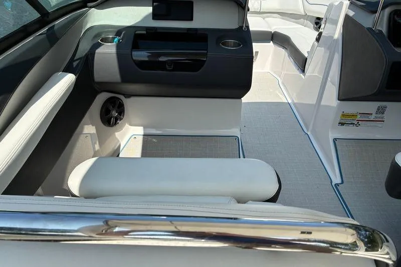 Slide: The Image of 2020 Regal LS4 boat interior with seating and storage compartments. - 13