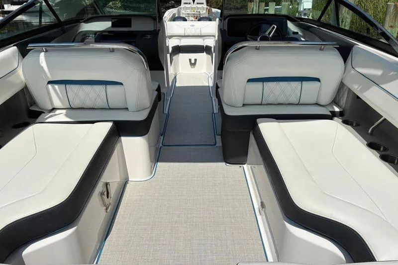 Slide: The Image of 2020 Regal LS4 boat interior with luxurious white seating and modern design. - 7