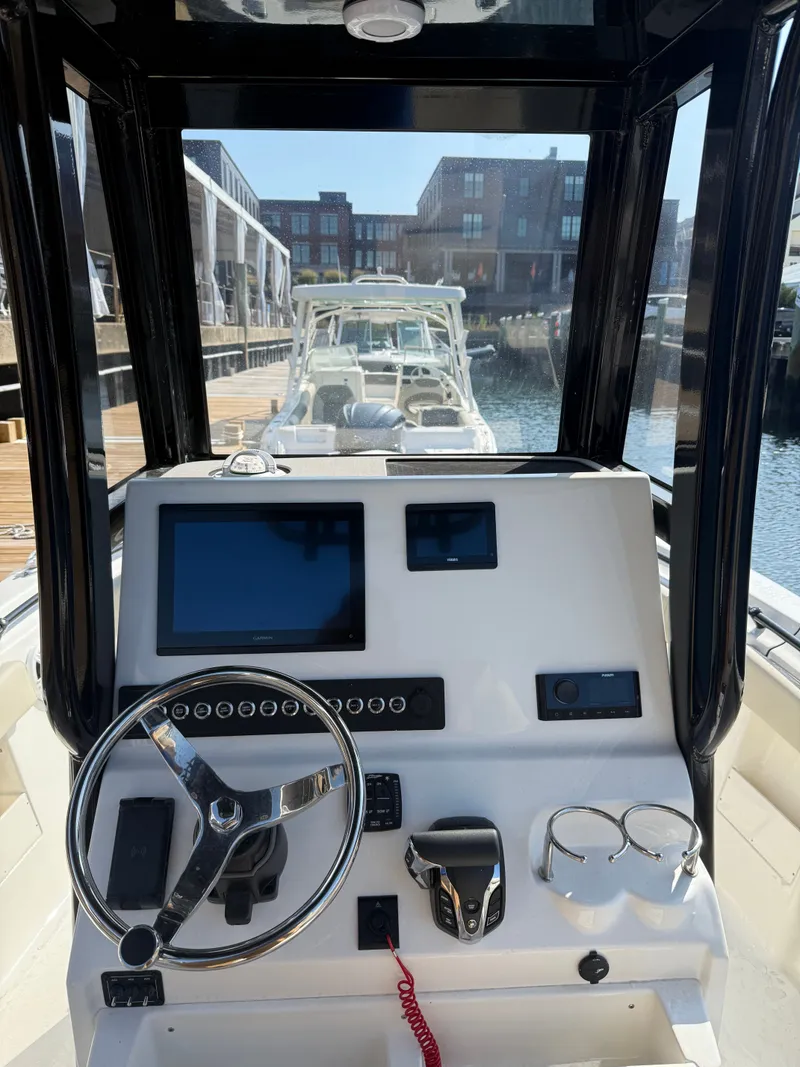 The Image of 2026 Key West 239 FS boat docked at marina under clear blue sky. - 0