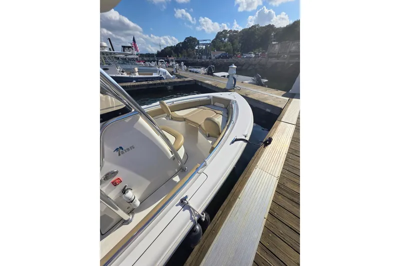 Slide: The Image of 2020 Key West 219 FS boat docked at marina under clear blue sky. - 16