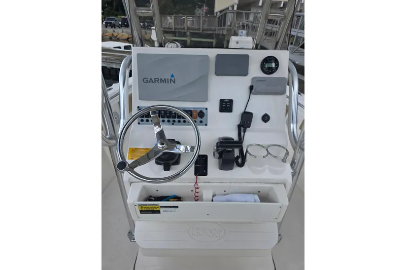 Slide: The Image of 2020 Key West 219 FS boat console with Garmin navigation system and steering wheel. - 21