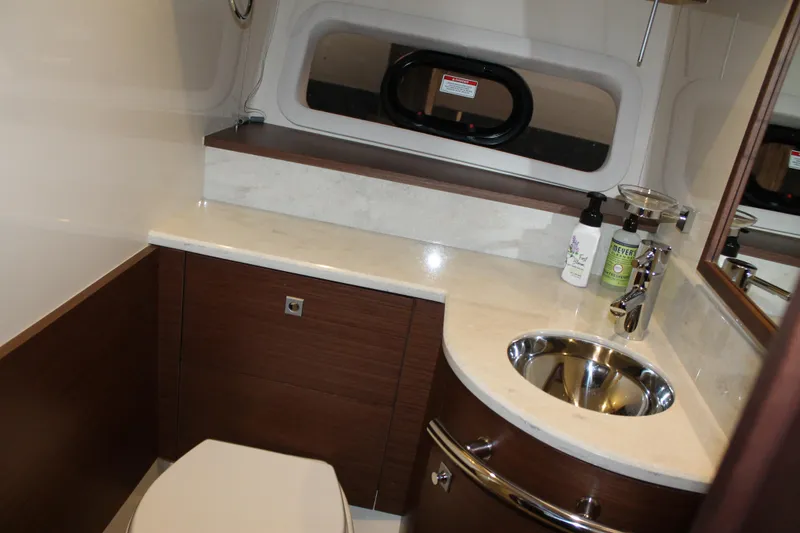 Slide: The Image of Luxurious bathroom in 2015 Sea Ray 470 Sundancer yacht with modern fixtures and elegant design. - 100