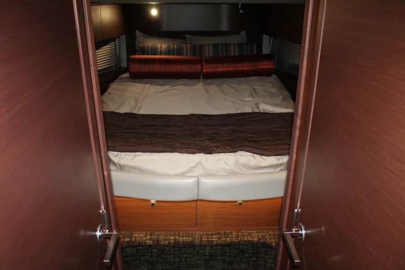 Slide: The Image of Luxurious bedroom interior of 2015 Sea Ray 470 Sundancer yacht with cozy bedding. - 103