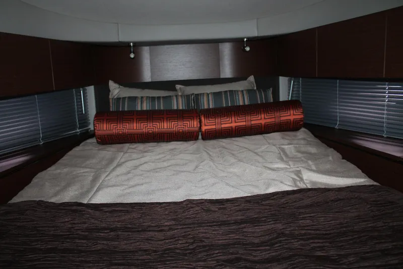 Slide: The Image of Luxurious cabin interior of 2015 Sea Ray 470 Sundancer yacht with elegant bedding. - 105