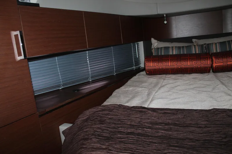 Slide: The Image of Luxurious cabin interior of 2015 Sea Ray 470 Sundancer yacht with elegant bedding. - 106