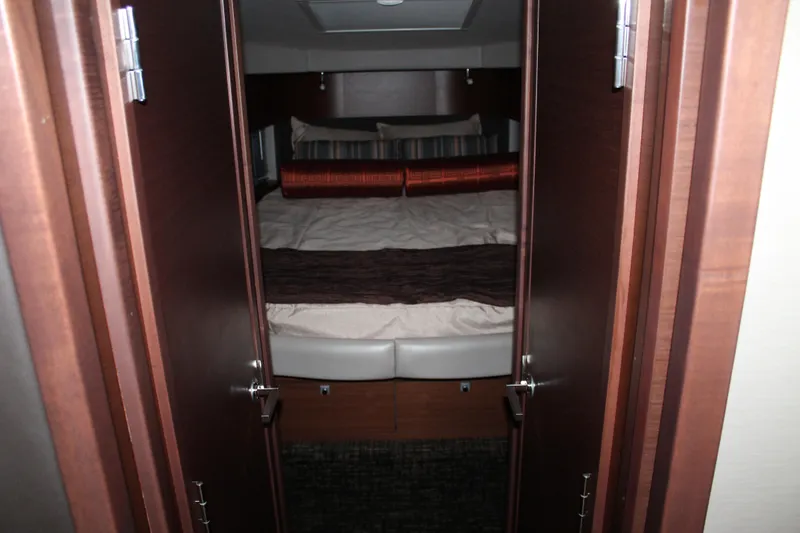 Slide: The Image of Interior cabin view of 2015 Sea Ray 470 Sundancer yacht with cozy bedding. - 110