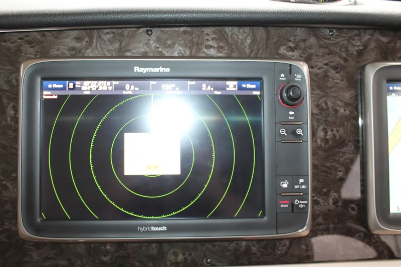 Slide: The Image of Raymarine navigation display on 2015 Sea Ray 470 Sundancer yacht dashboard. - 115