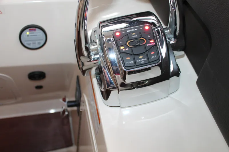 Slide: The Image of Control panel of a 2015 Sea Ray 470 Sundancer yacht, featuring throttle and docking controls. - 117