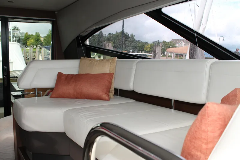 Slide: The Image of Luxurious interior of 2015 Sea Ray 470 Sundancer yacht with white seating and cushions. - 127