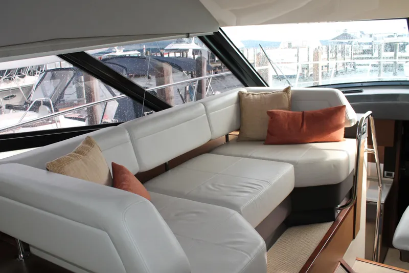 Slide: The Image of Luxurious interior of 2015 Sea Ray 470 Sundancer yacht with plush seating and cushions. - 129
