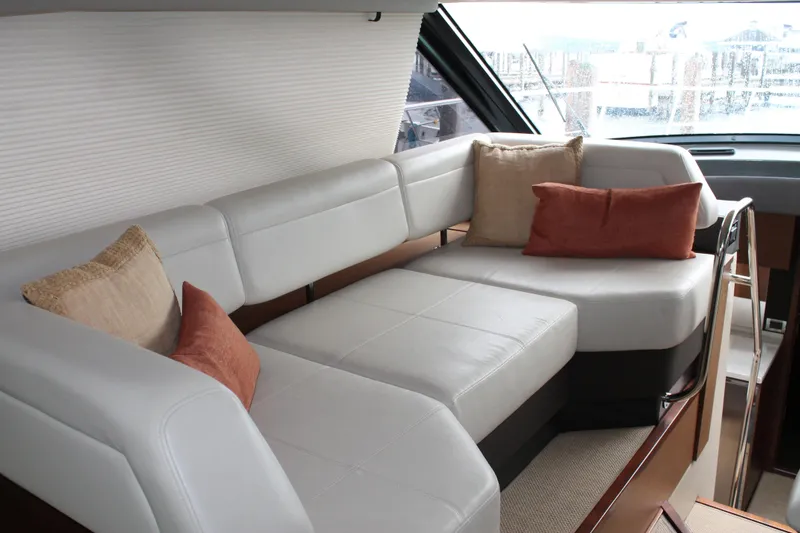 Slide: The Image of Luxurious interior of 2015 Sea Ray 470 Sundancer yacht with plush seating and cushions. - 130