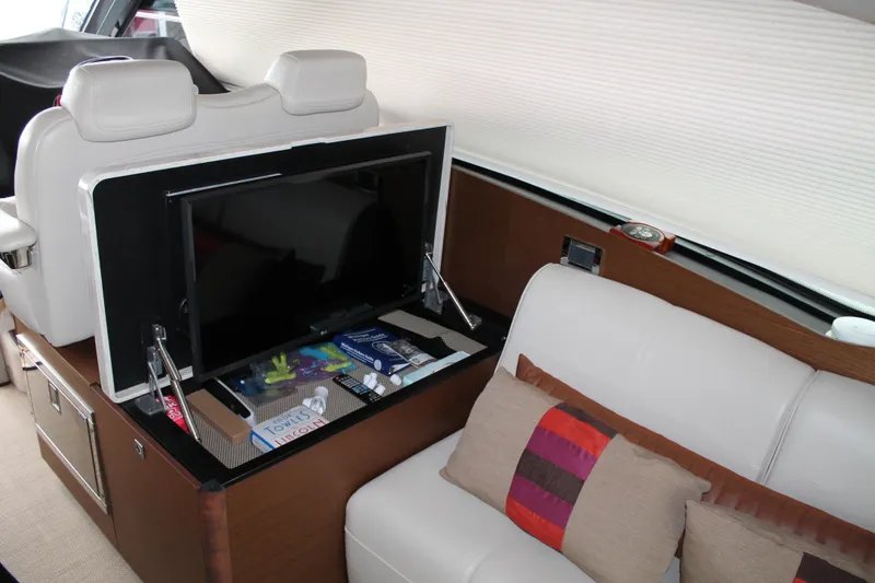 Slide: The Image of Luxurious interior of 2015 Sea Ray 470 Sundancer yacht with TV and plush seating. - 131