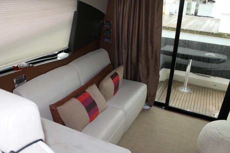 Slide: The Image of Interior of 2015 Sea Ray 470 Sundancer yacht with modern seating and colorful cushions. - 133