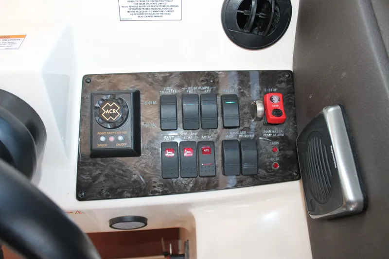 Slide: The Image of Control panel of 2015 Sea Ray 470 Sundancer boat with switches and indicators. - 19