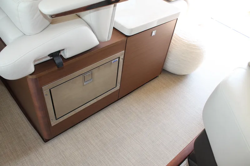 Slide: The Image of Interior of 2015 Sea Ray 470 Sundancer yacht with seating and storage. - 25