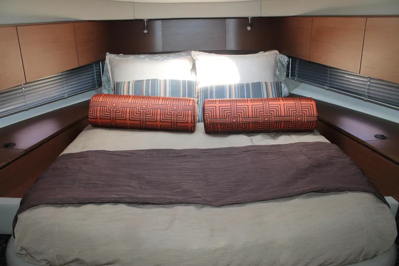 Slide: The Image of Luxurious bedroom interior of 2015 Sea Ray 470 Sundancer yacht with stylish bedding. - 33