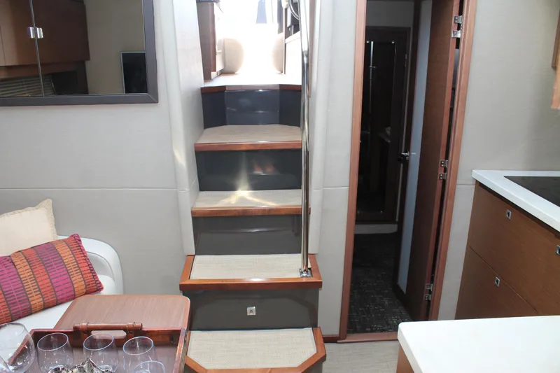 Slide: The Image of Interior of 2015 Sea Ray 470 Sundancer yacht with stairs and modern decor. - 39
