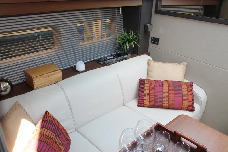 Slide: The Image of Luxurious interior of 2015 Sea Ray 470 Sundancer with elegant seating and decor. - 40