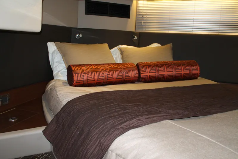 Slide: The Image of Luxurious bedroom interior of 2015 Sea Ray 470 Sundancer yacht with elegant bedding. - 48