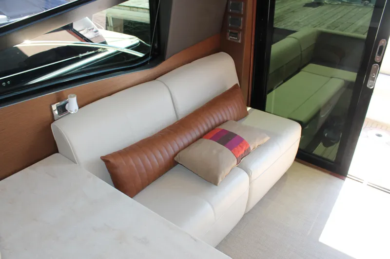 Slide: The Image of Luxurious interior of 2015 Sea Ray 470 Sundancer with elegant seating and cushions. - 9
