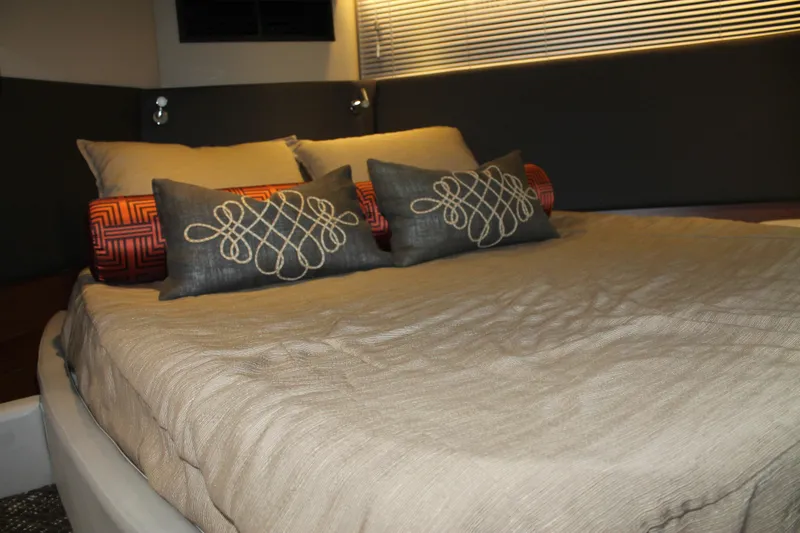 Slide: The Image of Luxurious bedroom interior of 2015 Sea Ray 470 Sundancer yacht with elegant bedding. - 92