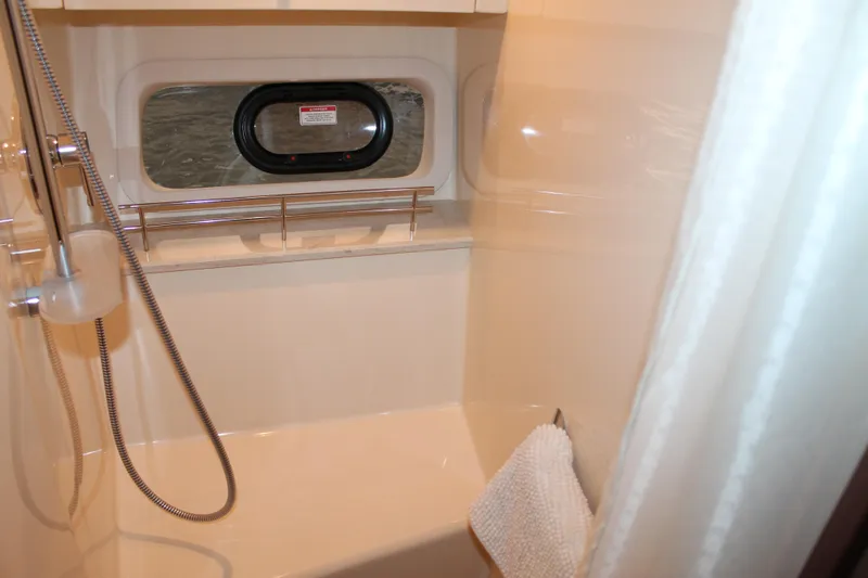 Slide: The Image of Bathroom interior of 2015 Sea Ray 470 Sundancer yacht with shower and window. - 99