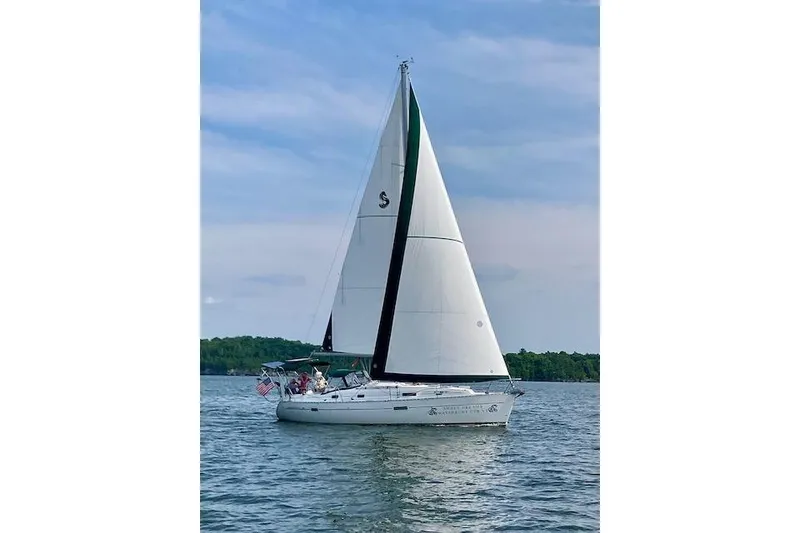 The Image of 2003 Beneteau Oceanis Clipper 361 sailboat on calm water under clear sky. - 0