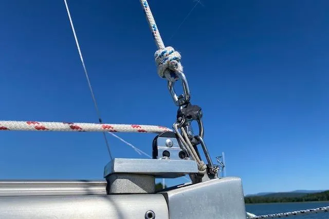 Slide: The Image of Close-up of rigging on a 2003 Beneteau Oceanis Clipper 361 sailboat under clear blue sky. - 10