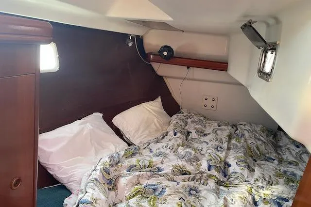 Slide: The Image of Cozy cabin interior of 2003 Beneteau Oceanis Clipper 361 sailboat with floral bedding. - 30