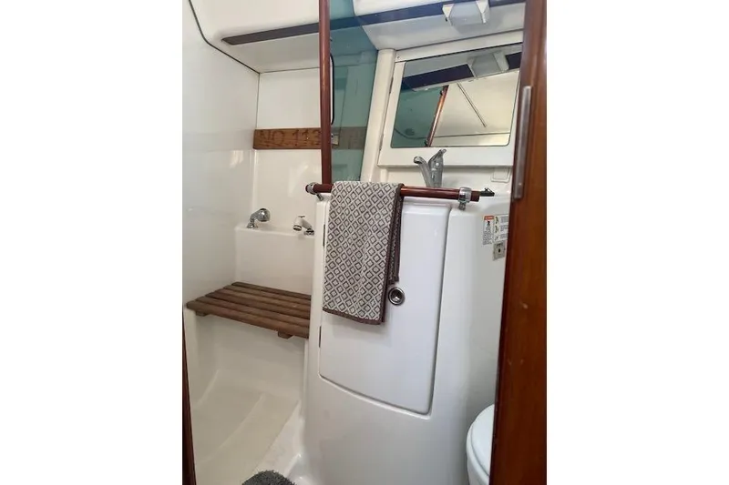 Slide: The Image of Bathroom interior of 2003 Beneteau Oceanis Clipper 361 yacht, featuring sink and mirror. - 31